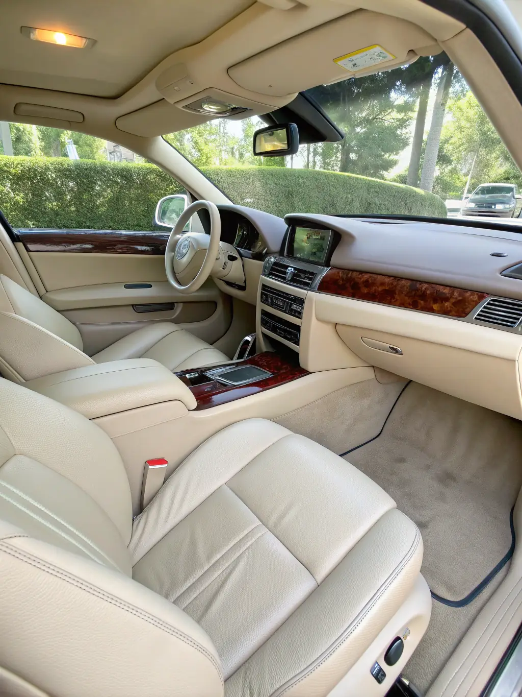 A close-up shot of a car's air vent, with a beam of light shining through, highlighting the absence of dust and allergens, symbolizing improved air quality after interior detailing.